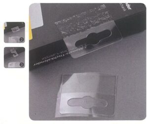 Αυτοκόλλητο πλαστικό κρεμαστάρι με τρύπα 4,7x5εκ. (500τεμ/ρολλό)